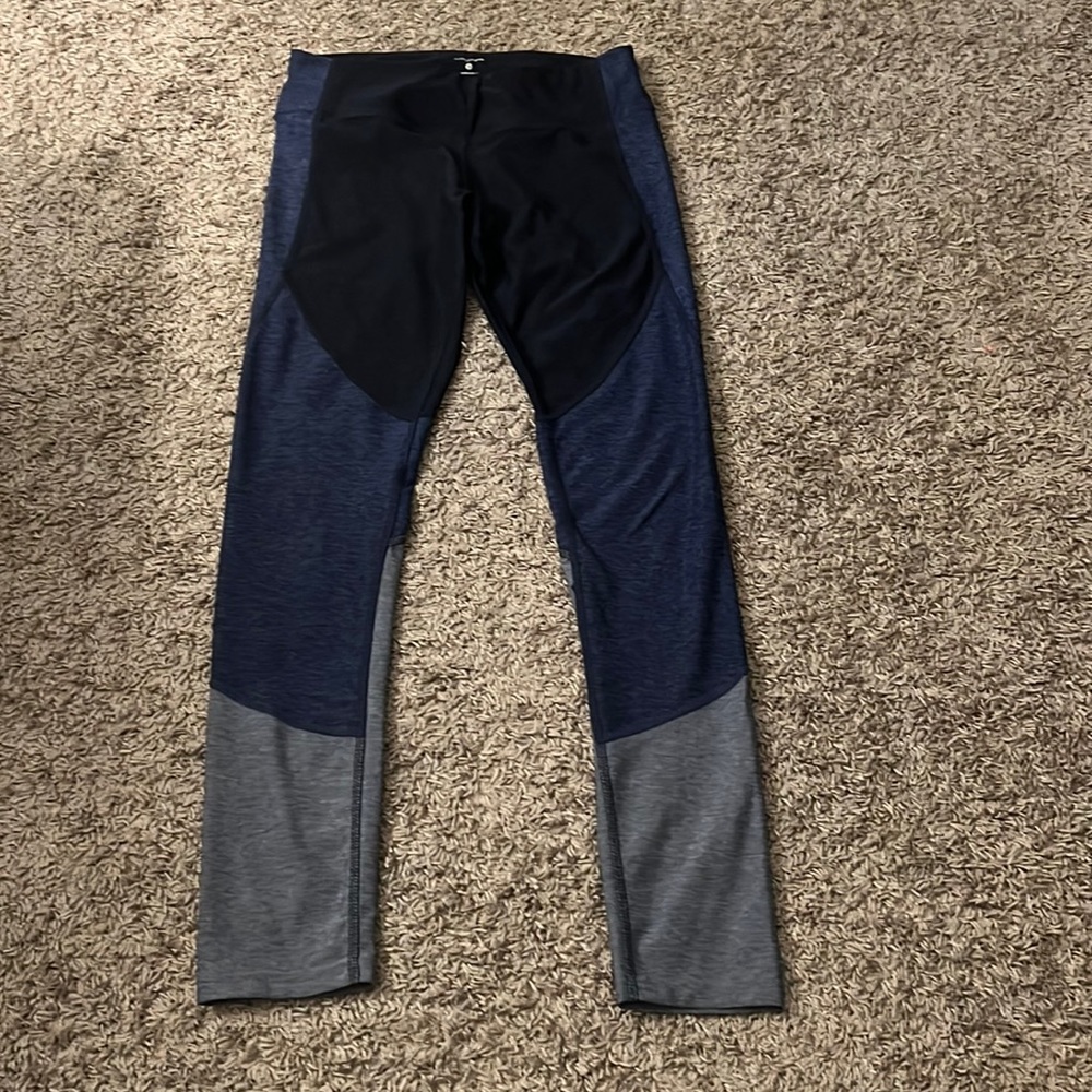 Leggings -navy blue/black/grayish blue layered colors. One small tear inside-hip